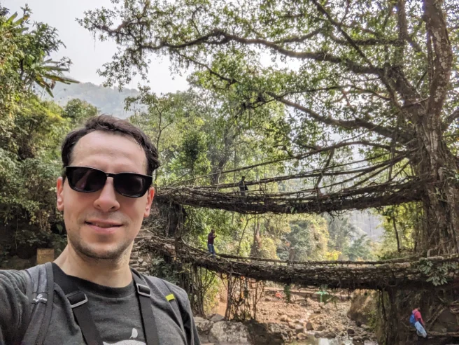 Adam in front of the double-root tree bridge