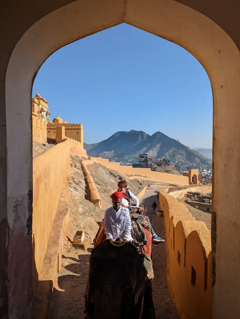 Riding Elephants - through a gate