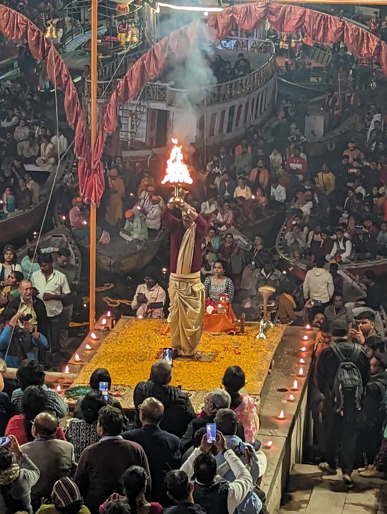 Priest with fire at evening prayer in Varanasi, the Ganges River