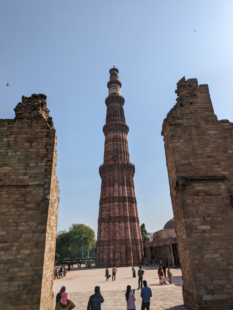 Qutub Minar - the ancient unfinished structres with the pilar in the middle