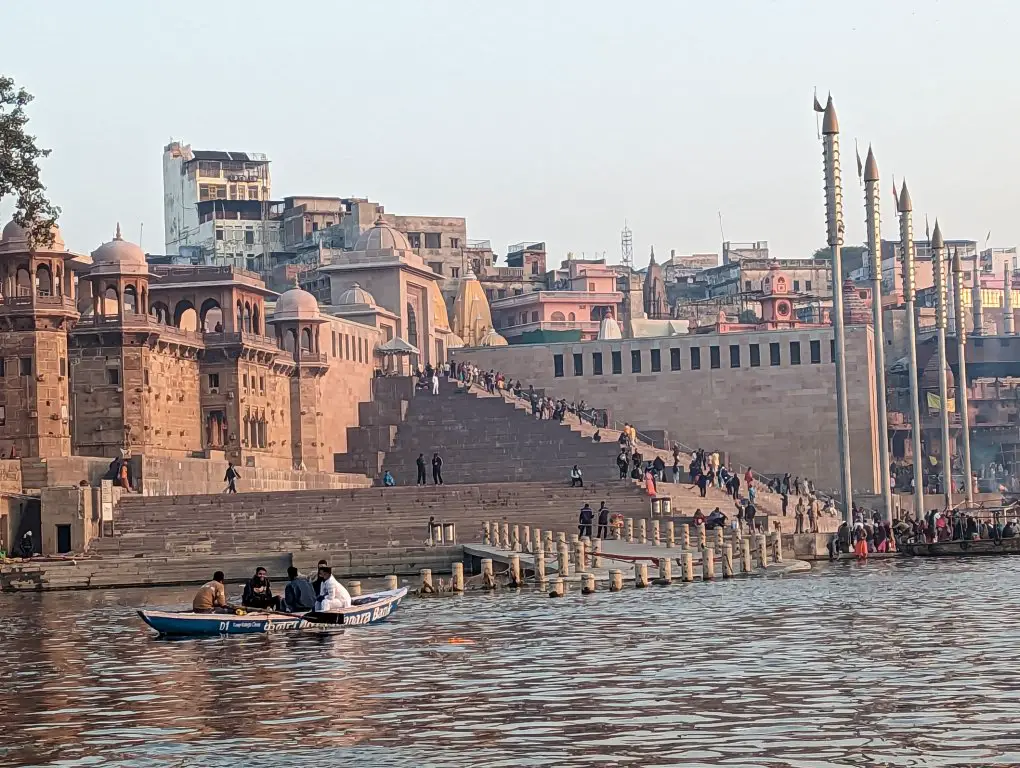 Long view of a Ghat with a lot of stairs from the Ganges River in Varanasi - Ganges Boat Ride